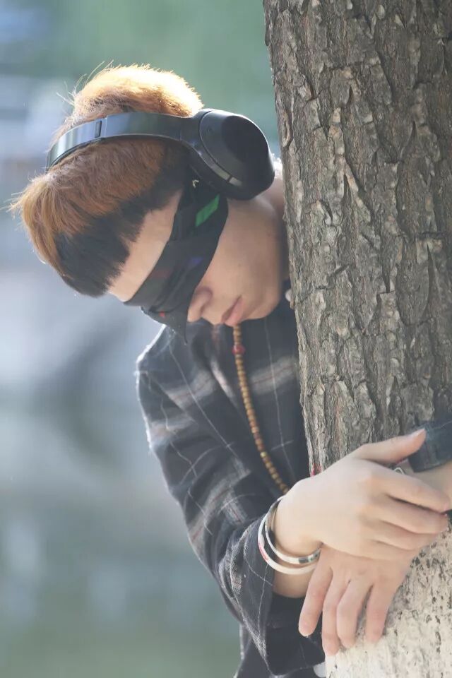 Close-up of the performer embracing the tree during Embrace action